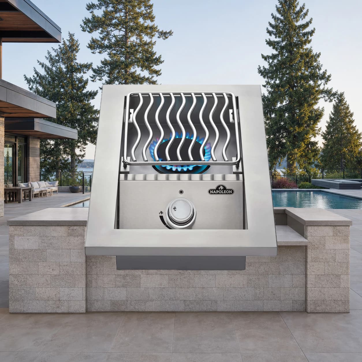 Built-in 500 Series Single Range Top Burner, Stainless Steel Cover in a modern poolside backyard