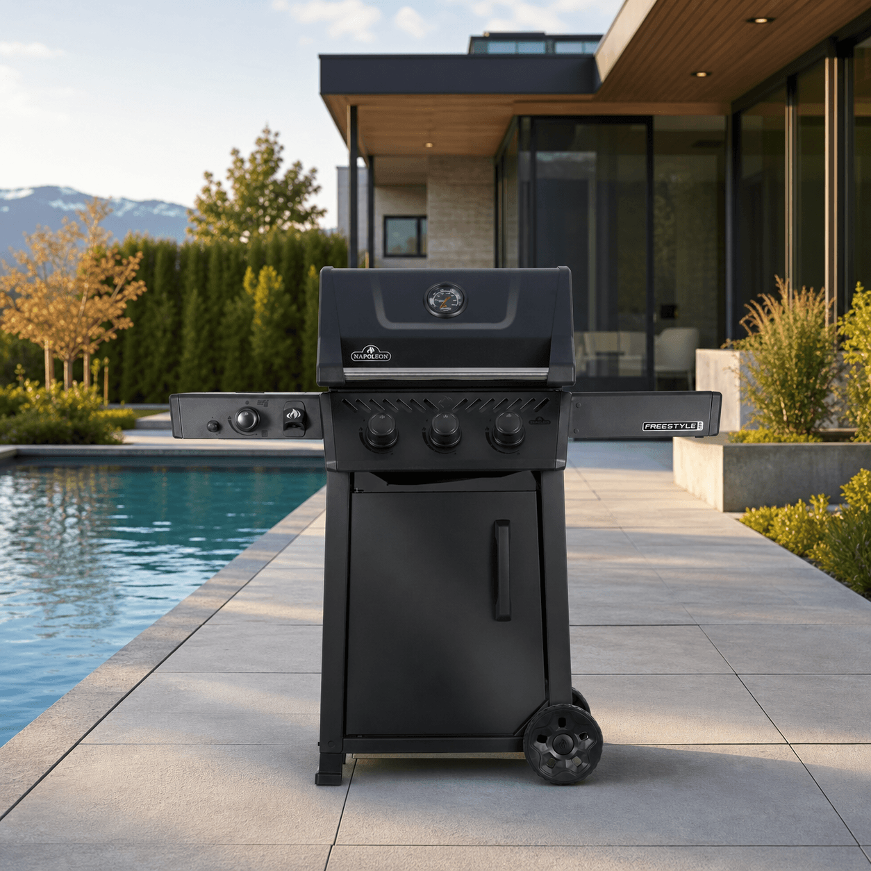 Freestyle™ PRO 365 Propane Gas Grill with Infrared Side Burner, Matte Black in a modern poolside backyard