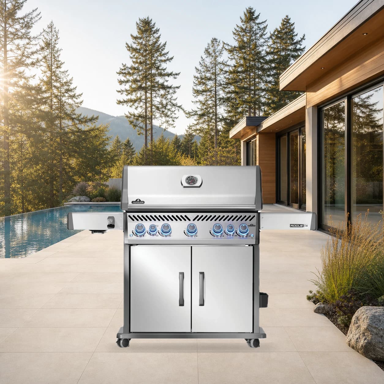 Rogue® PRO-S 625 Propane Gas Grill with Infrared Side and Rear Burners, Stainless Steel in a modern poolside backyard
