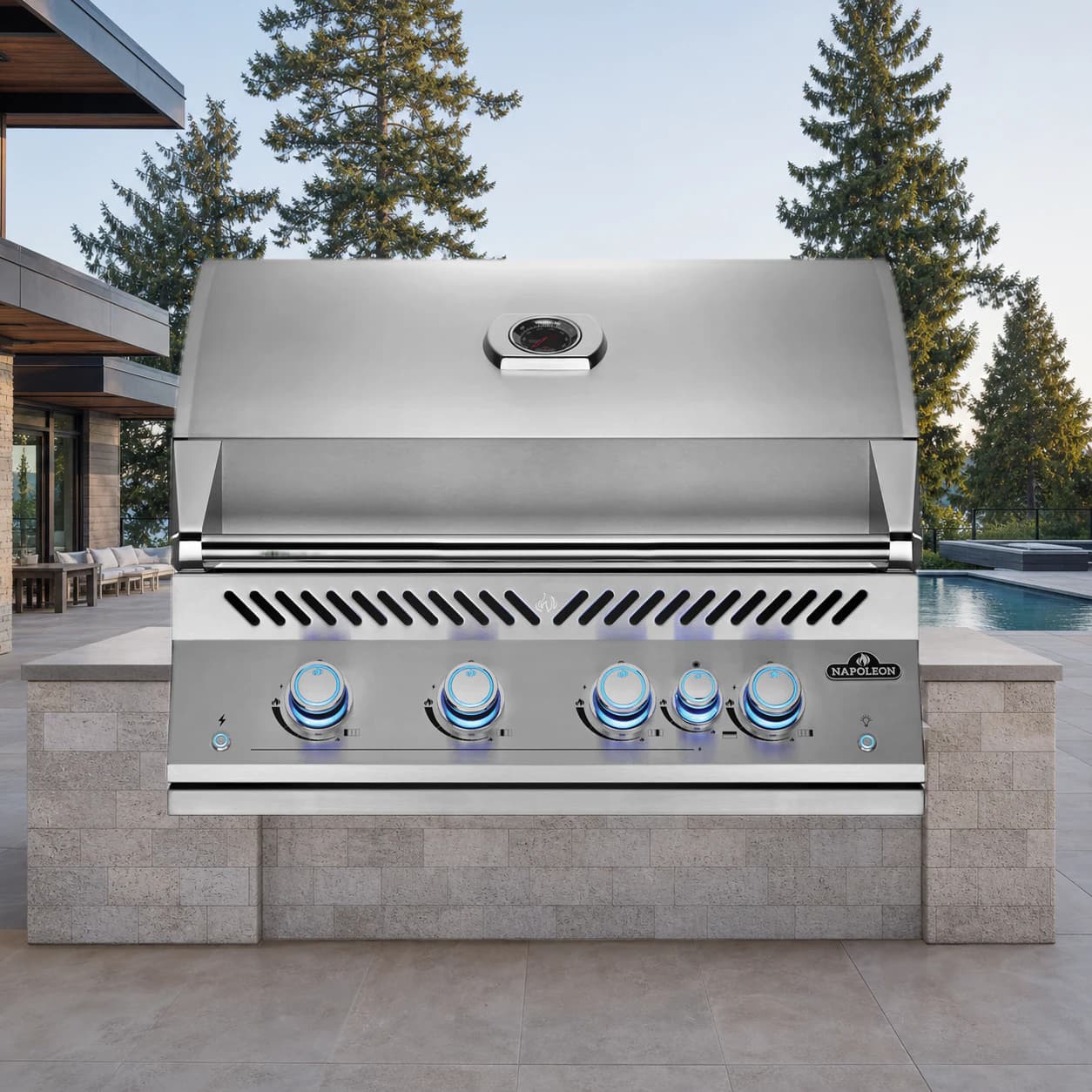 Built-In 700 Series 32" with Infrared Rear Burner Natural Gas, Stainless Steel in a modern poolside backyard