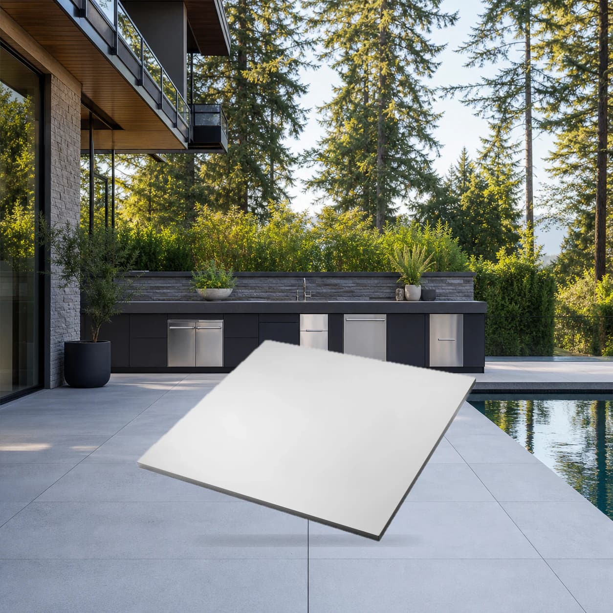 OASIS® 24" x 26" Stainless Steel End Countertop in a modern poolside backyard