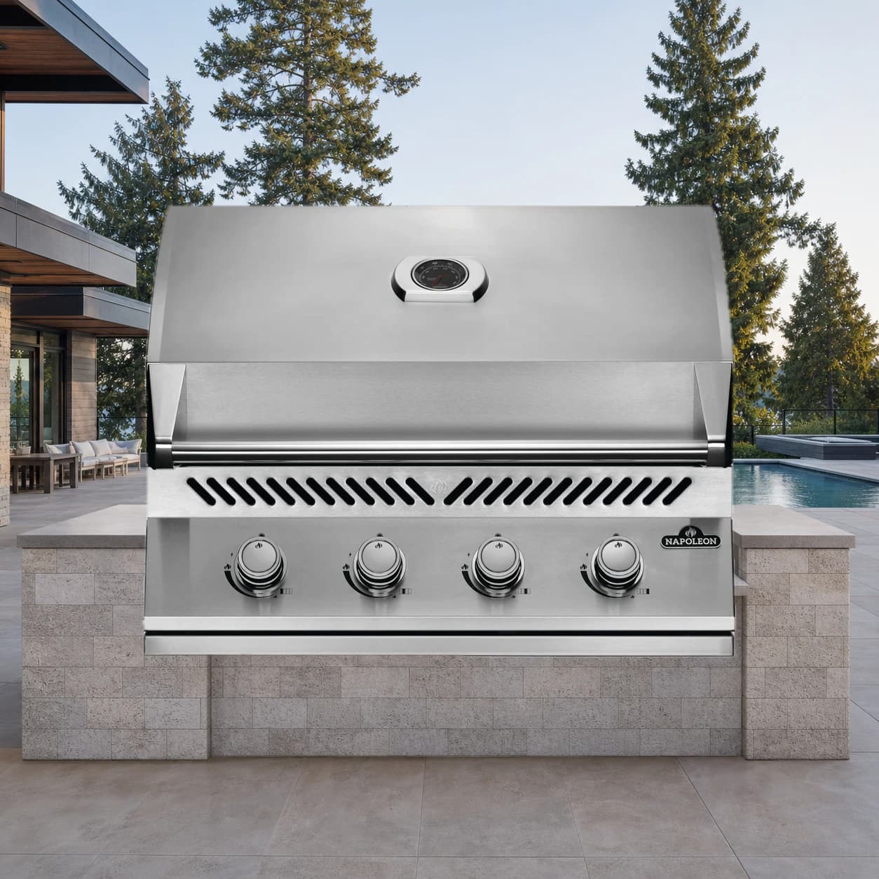 Built-in 500 Series 32 Propane, Stainless Steel in a modern poolside backyard