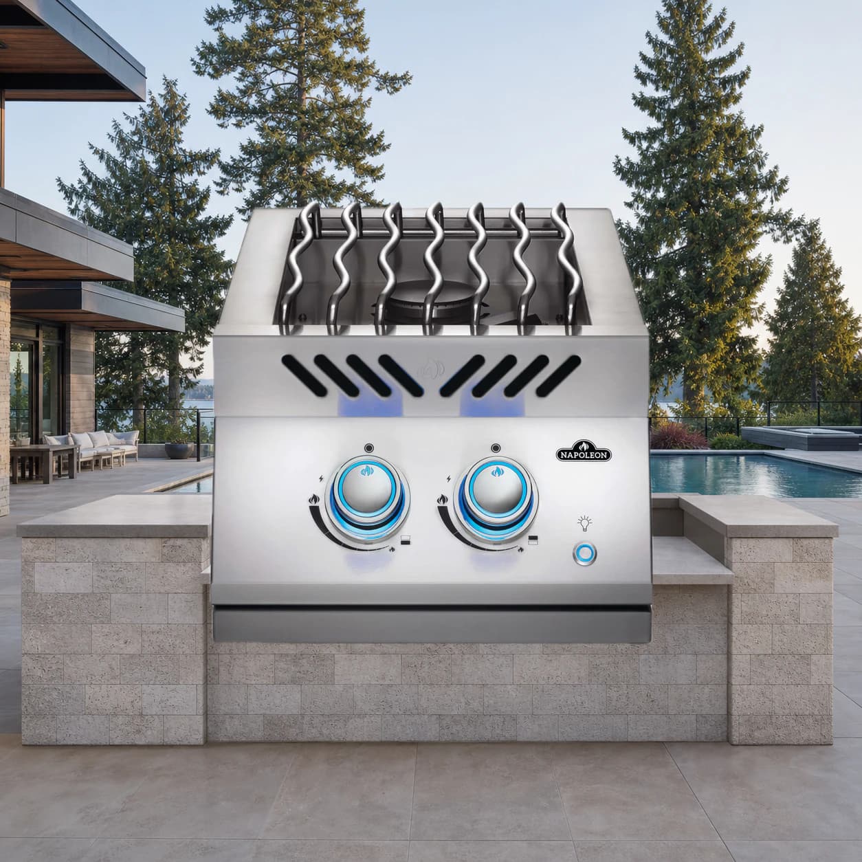 Built-in 700 Series 12" Inline Dual Range Burner Propane, Stainless Steel in a modern poolside backyard