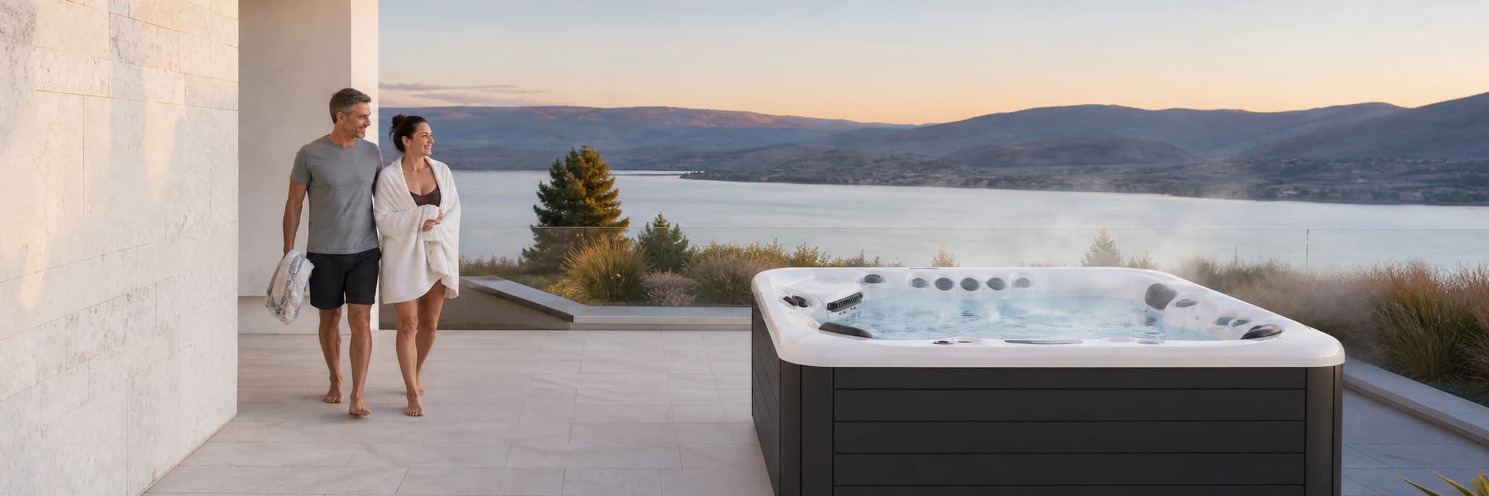 Realistic Platinum Spas Portofino hot tub on a bright Okanagan Lake terrace at dusk