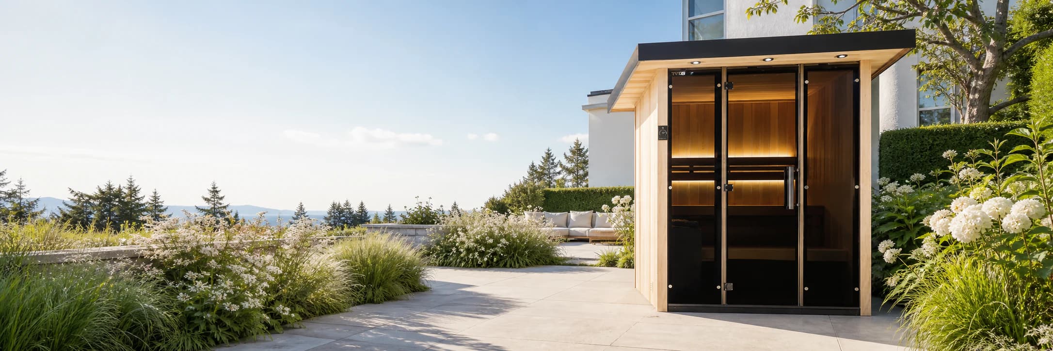 Tylo Lulea outdoor sauna in a bright landscaped garden