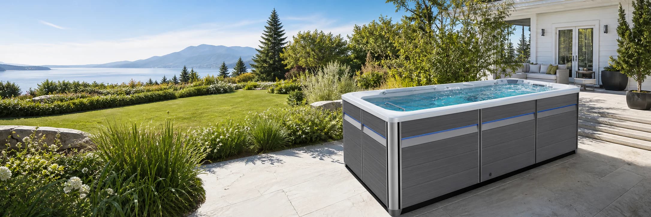 Endless Pools E500 swim spa in a bright mountain lake setting