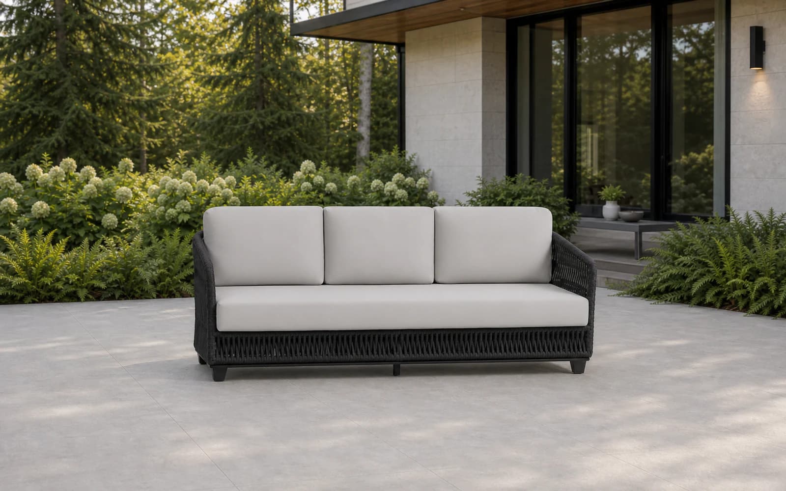Ratana Gemelli Collection furniture in a modern Pacific Northwest outdoor living setting.