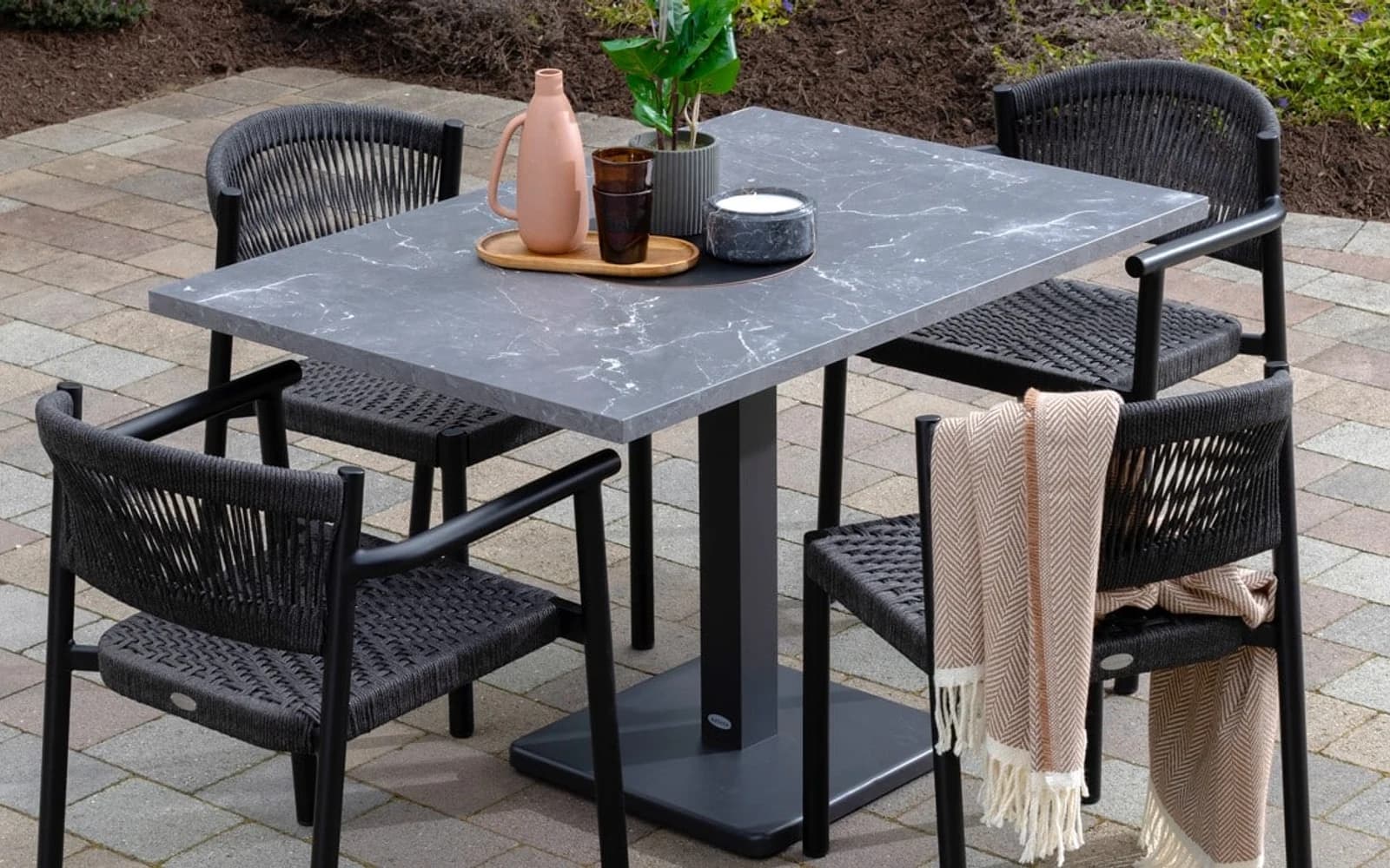 Ratana Naples Collection furniture in a modern Pacific Northwest outdoor living setting.