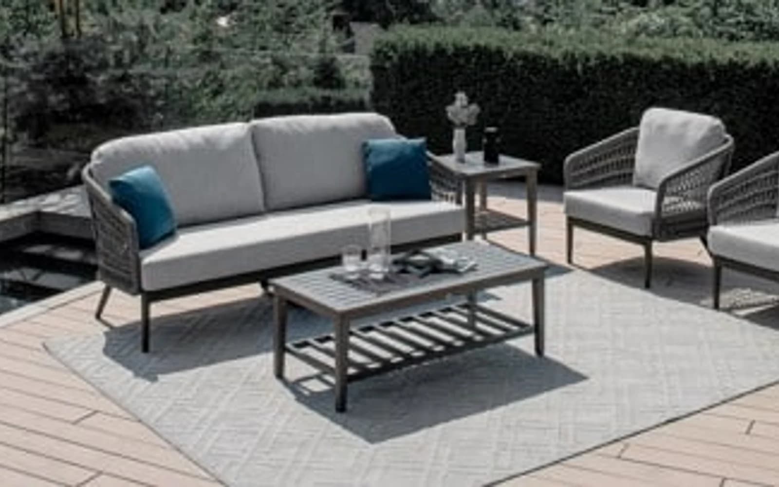 Ratana Poinciana Collection furniture in a modern Pacific Northwest outdoor living setting.