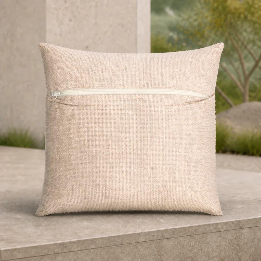 Ratana CU01320 Cova 20-inch square oatmeal toss pillow with zipper on a premium stone patio.
