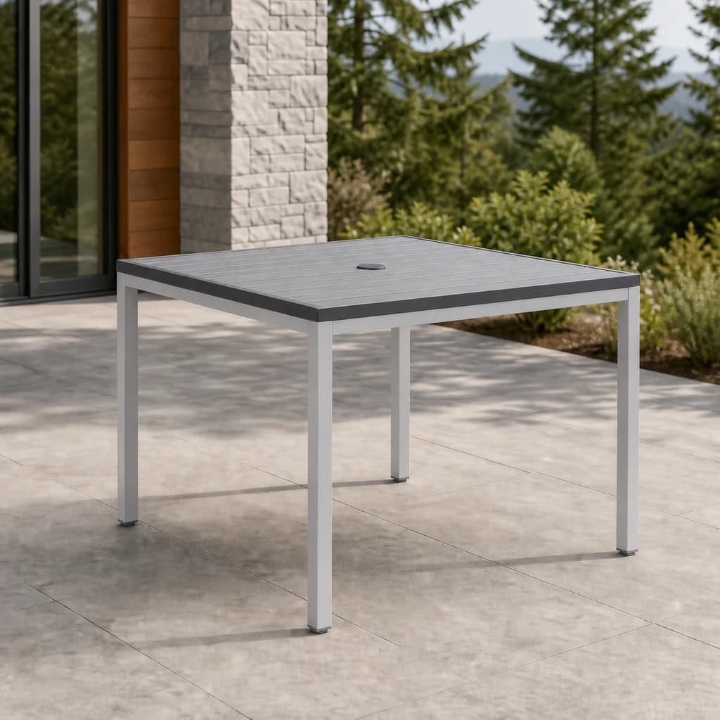 Ratana FN28210AN Zuni square dining table with charcoal aluminum slatted top, center umbrella hole, and silver frame.