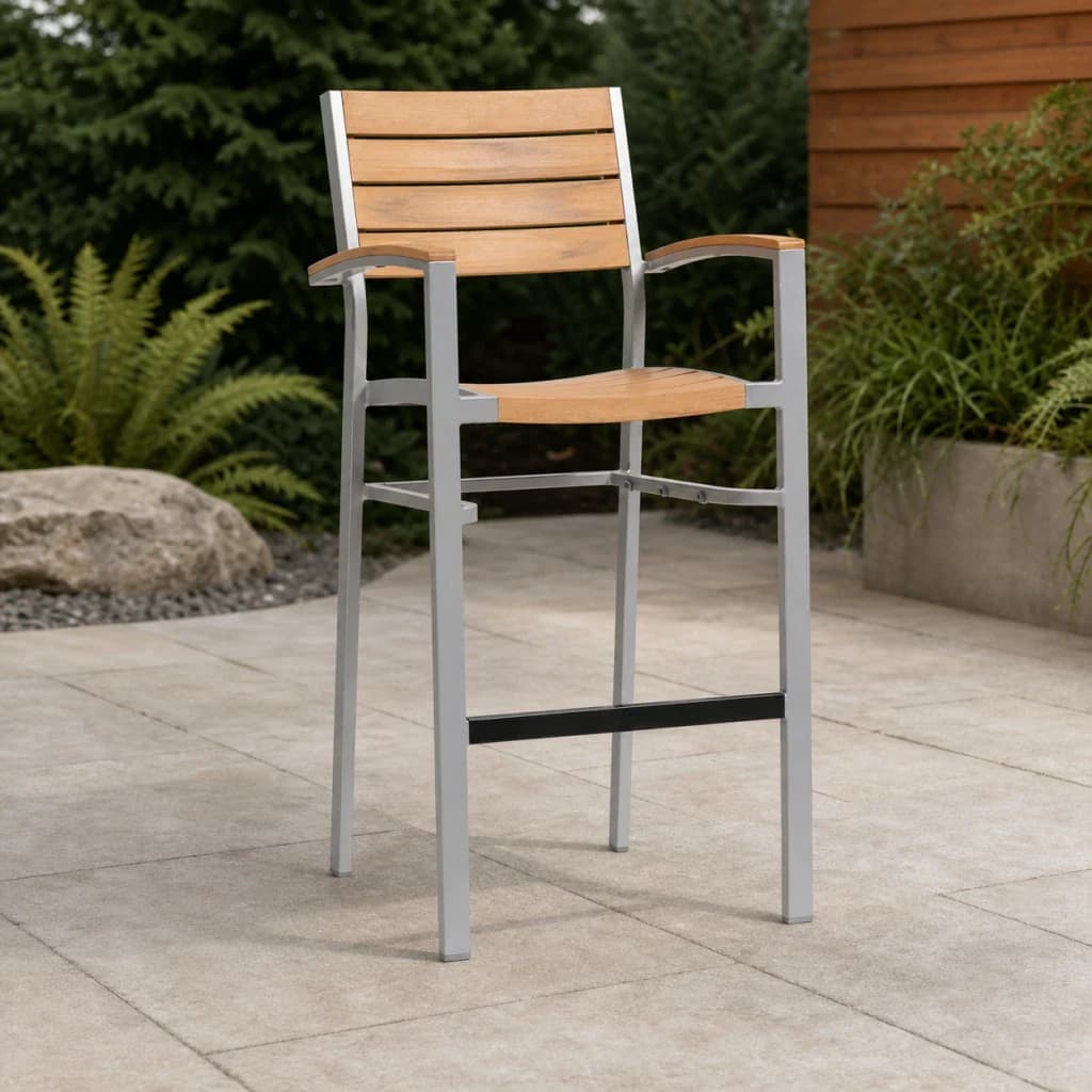 Ratana FN42944-B New Mirage stackable bar chair with teak arms and slats, silver frame, and black footrest on a premium patio.