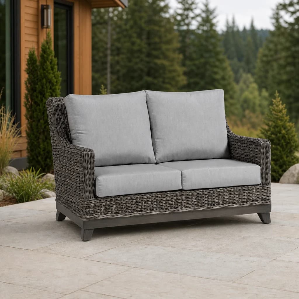 Ratana FN51702 Boston Love Seat with four light gray cushions and taupe woven frame on a Pacific Northwest patio.