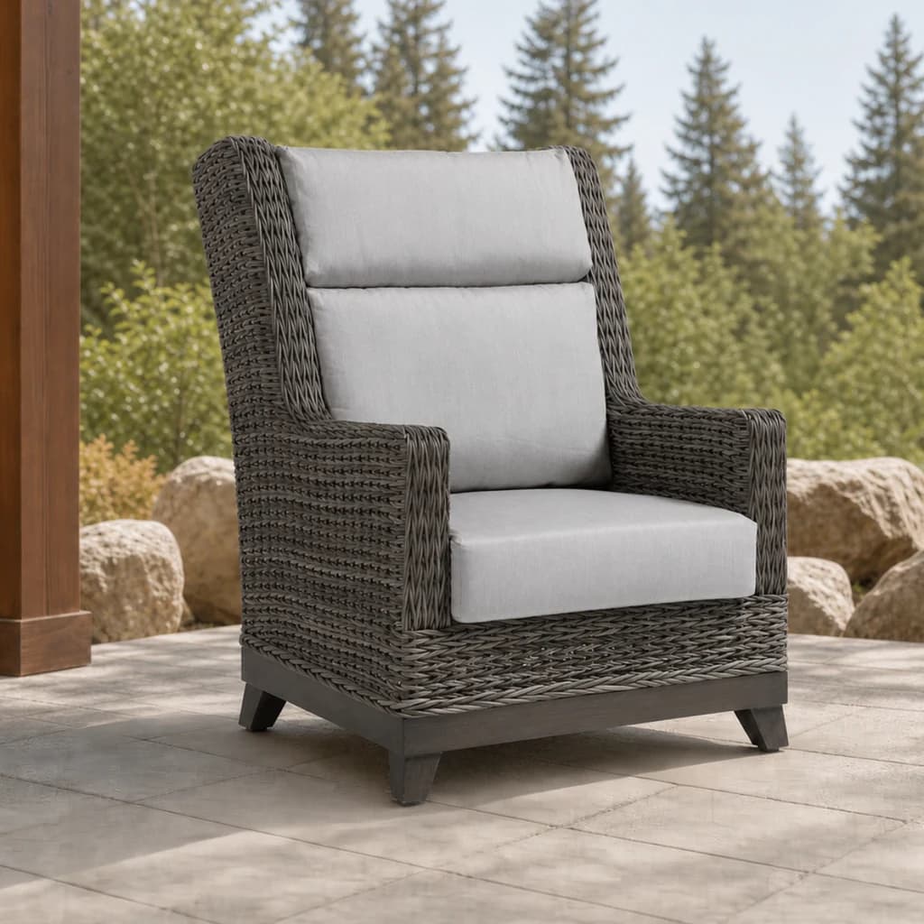 Ratana FN51785 Boston Highback Wing Chair with light gray cushions and taupe wicker on a premium stone patio.