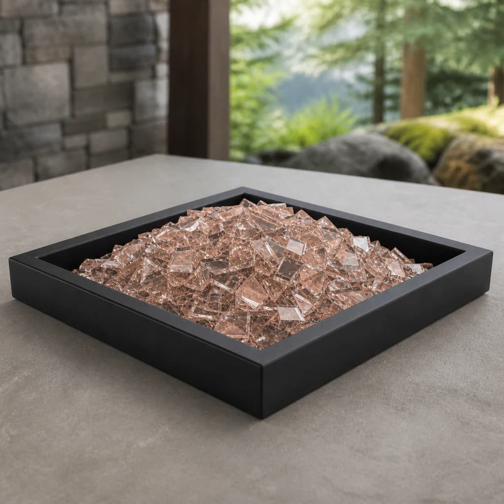 Ratana FN52400COP-RGLP-RGLP-RGLP-RGLP-RGL pale copper-blush reflective fire glass displayed in a black outdoor fire-pit tray.