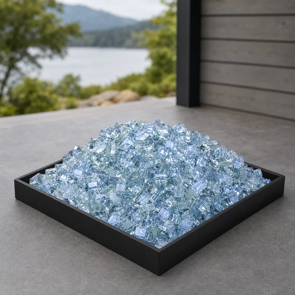 Ratana FN52400PAB-RGLB-RGLB-RGLB-RGLB-RGL pale Pacific blue reflective fire glass displayed in a black outdoor fire-pit tray.