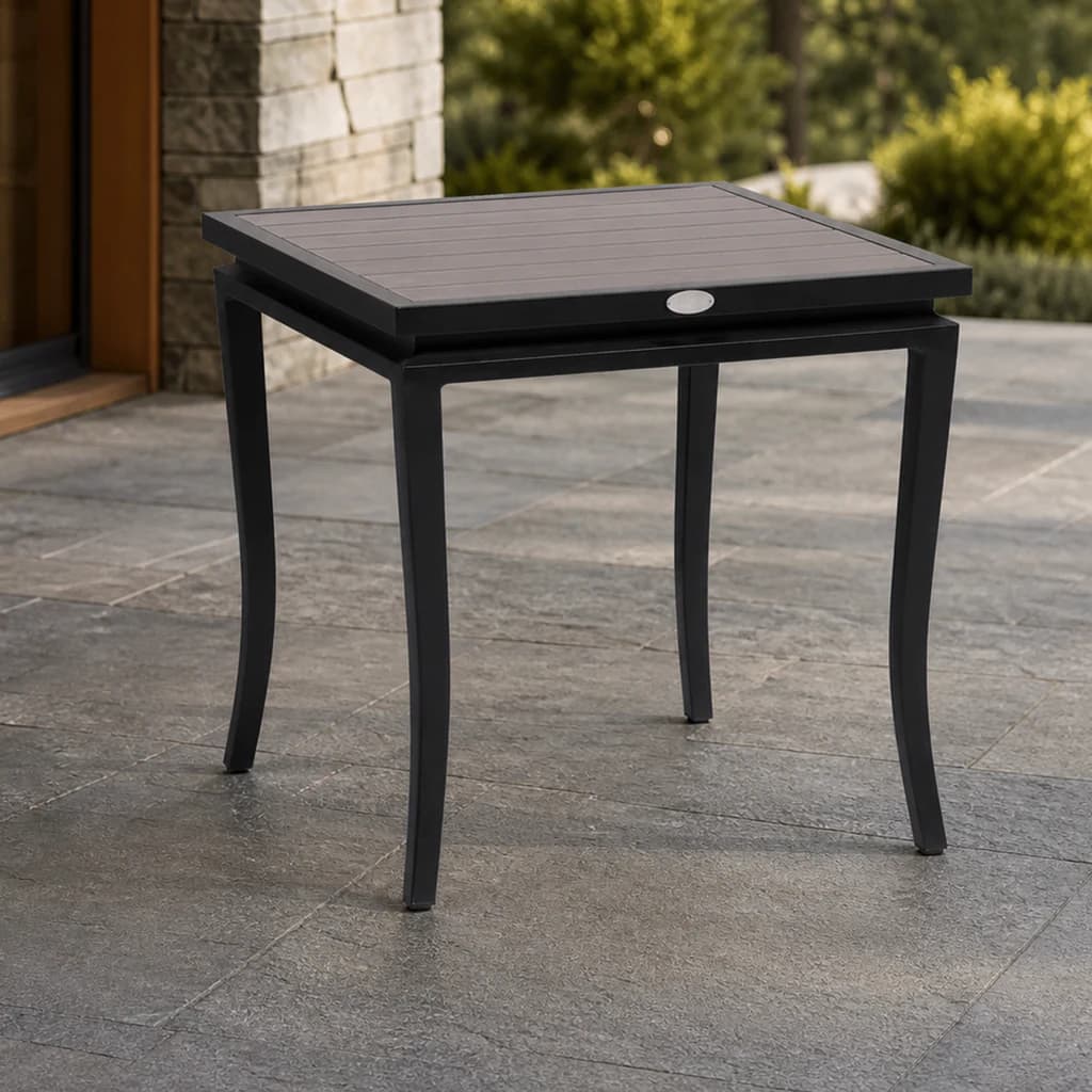 Ratana FN55005 Copacabana aluminum-top end table on a covered evergreen patio.