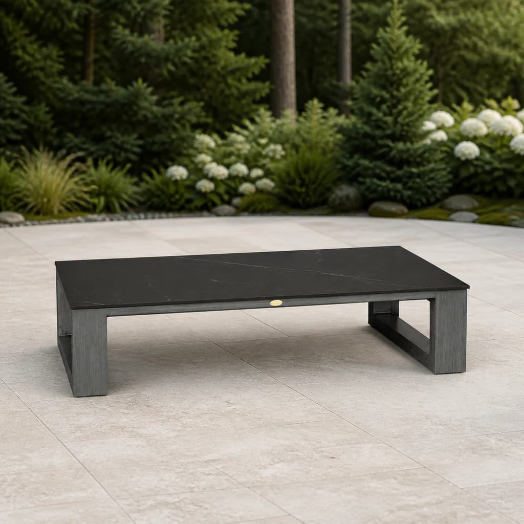 Ratana FN57004 Element 5.0 rectangular sintered-stone coffee table on an evergreen patio.