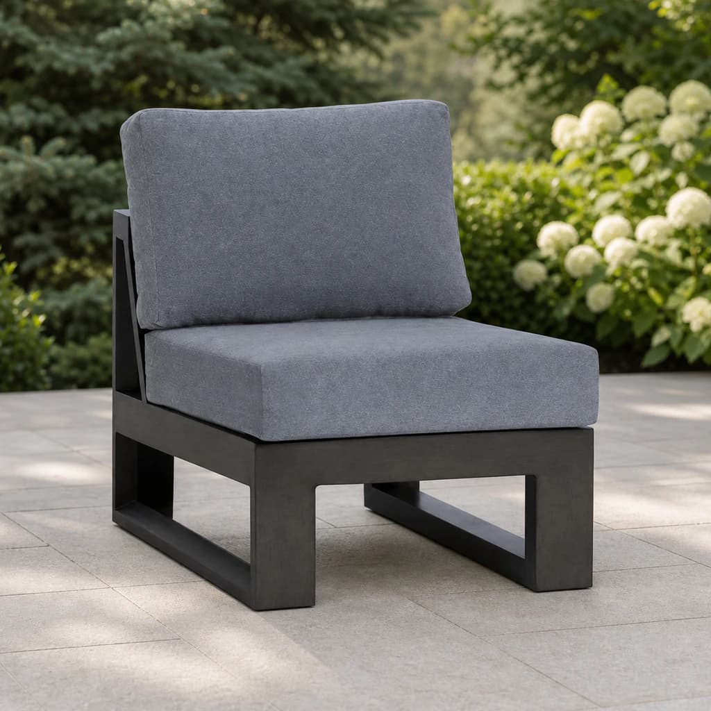 Ratana FN57053-C Element 5.0 armless chair module on an evergreen patio.