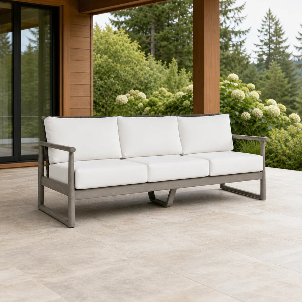 Ratana FN58703 Park West three-seat sofa on a covered evergreen terrace.
