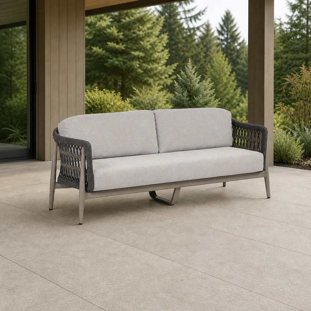 Ratana FN60103 Coconut Grove 2.5-seater Sofa with two back cushions on a covered forest patio.