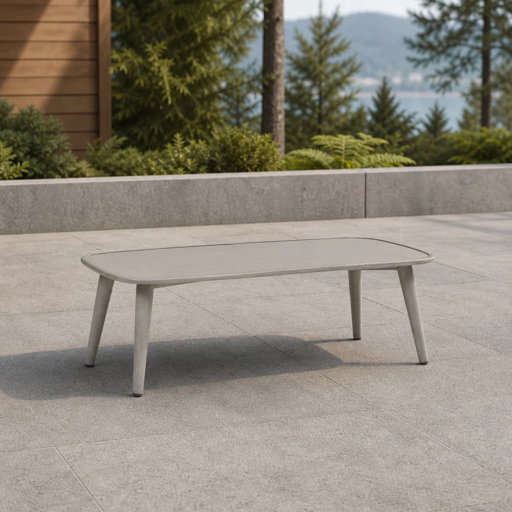 Ratana FN60104-T47 Coconut Grove 23 by 47 inch coffee table on a lake-view patio.