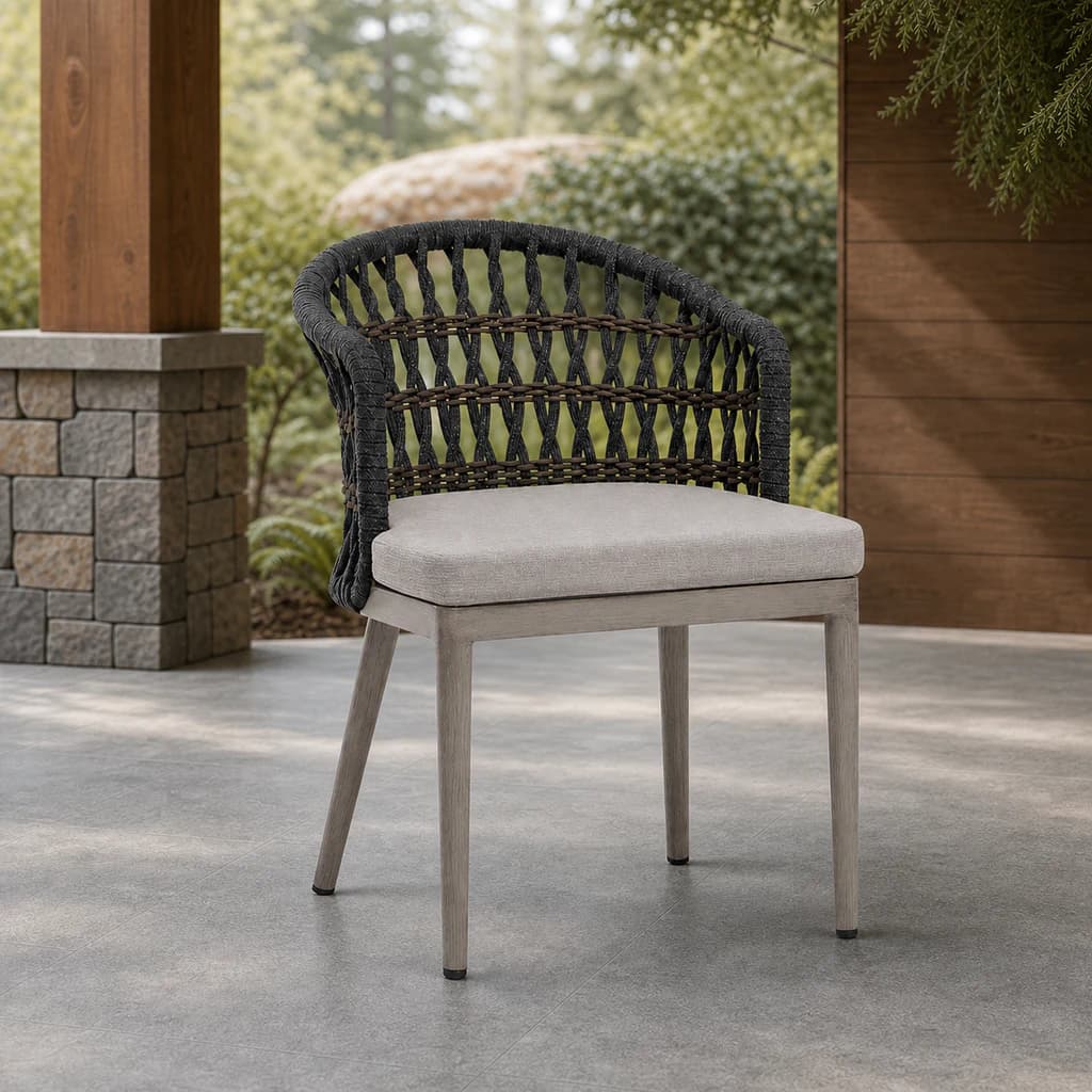 Ratana FN60112 Coconut Grove dining arm chair on a cedar and stone patio.
