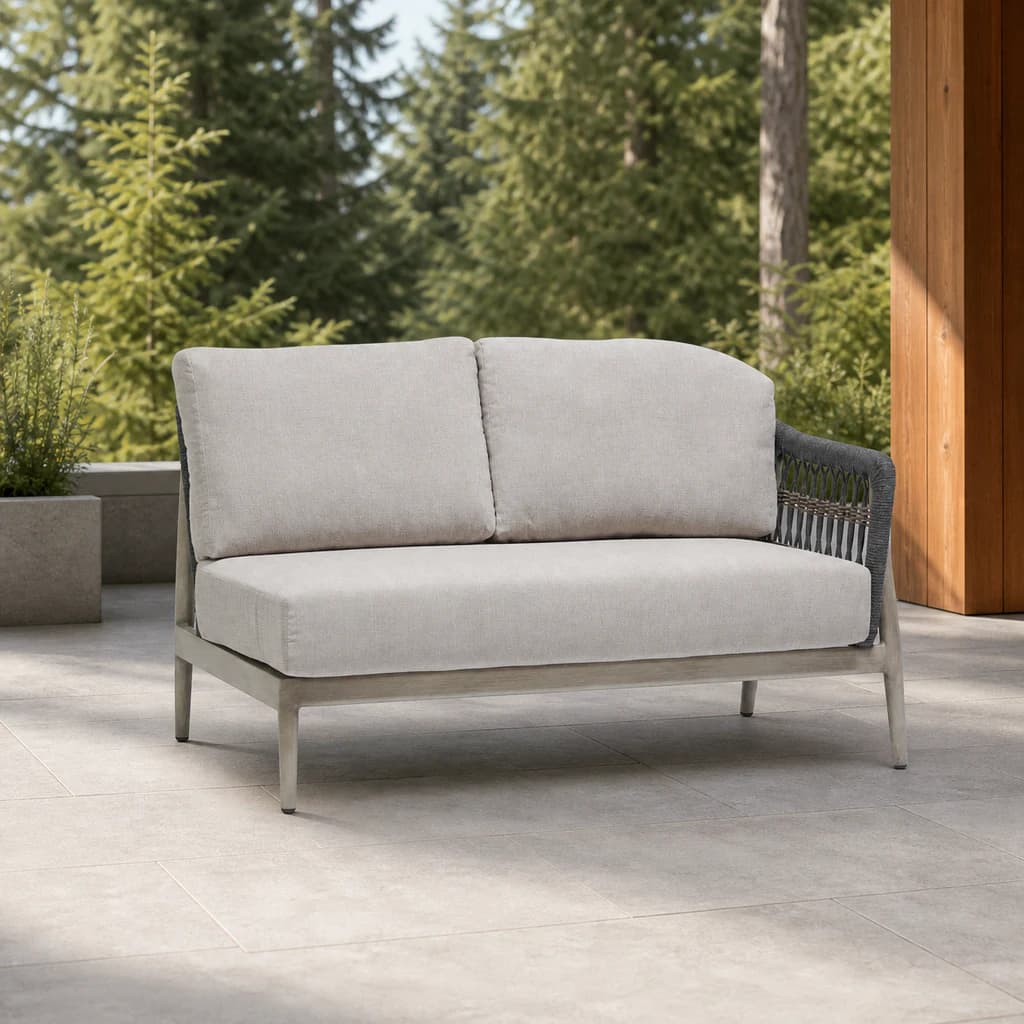 Ratana FN60152-R Coconut Grove two-seat right-arm module on an evergreen patio.
