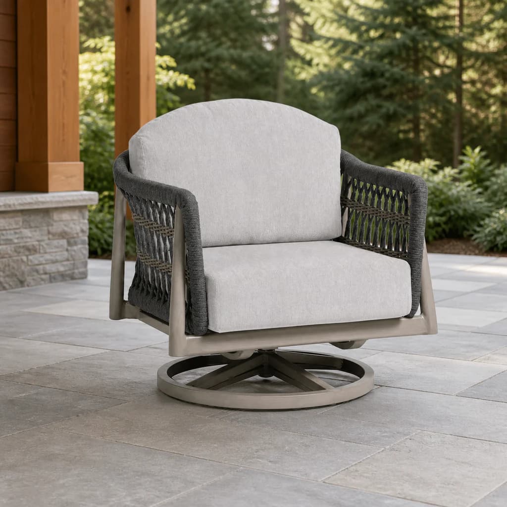 Ratana FN60168 Coconut Grove Swivel Rocker with circular base on an evergreen patio.