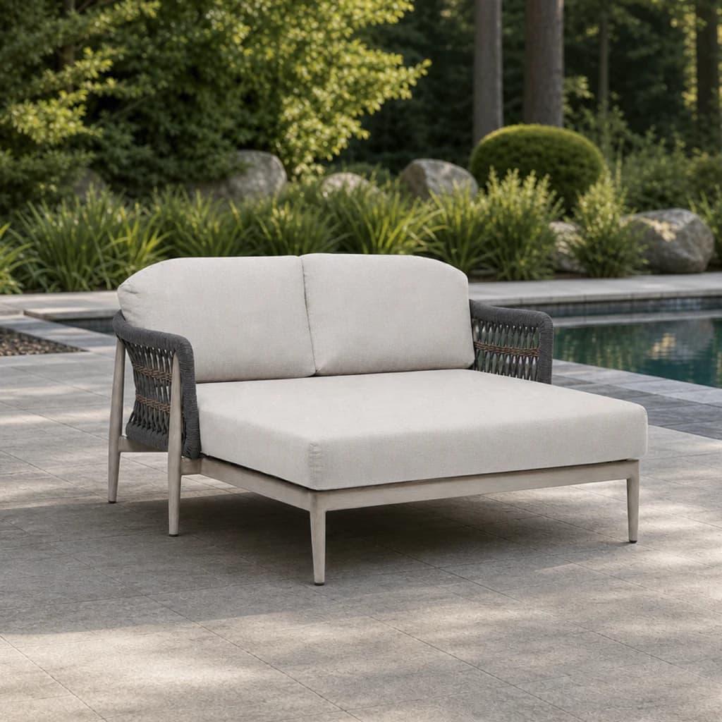 Ratana FN60171 Coconut Grove daybed with two back cushions beside an evergreen pool.