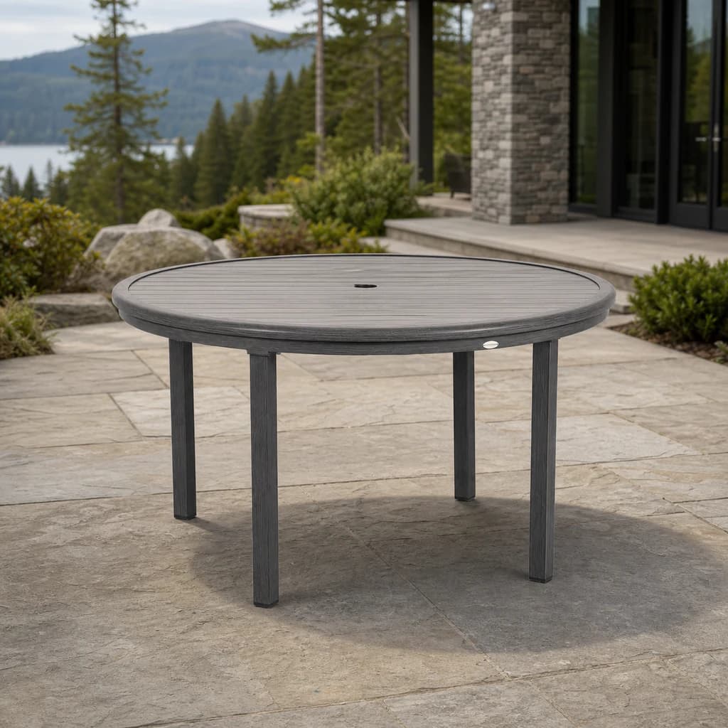 Ratana FN61115 Canbria 54-inch round dining table with umbrella hole on a mountain patio.