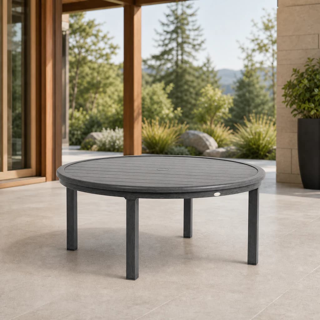 Ratana FN61117 Canbria 48-inch round conversation table with umbrella-hole cover on a Pacific Northwest patio.