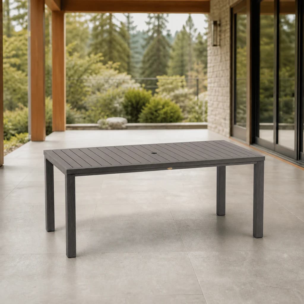 Ratana FN61162 Canbria 71-by-39-inch rectangular dining table with umbrella hole on a stone patio.