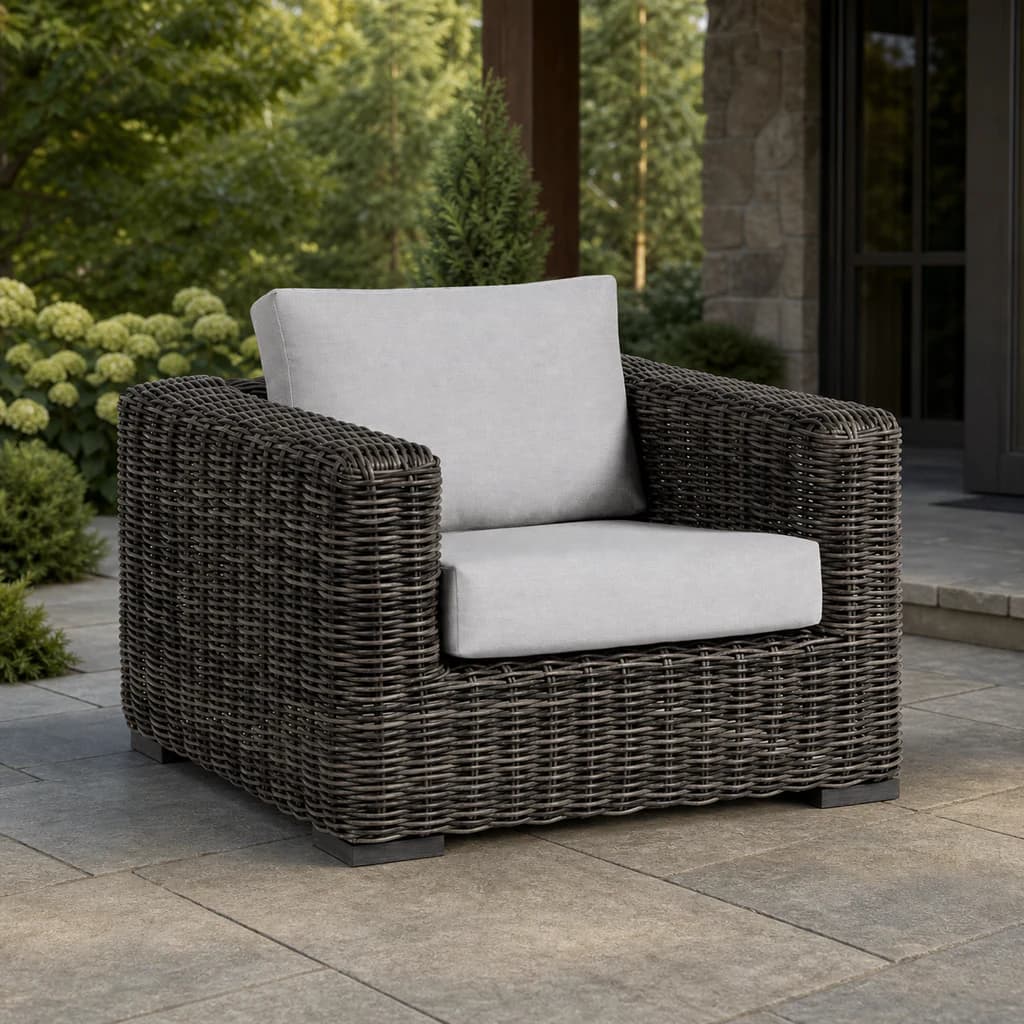 Ratana FN61201 Cubo club chair on a covered evergreen patio.