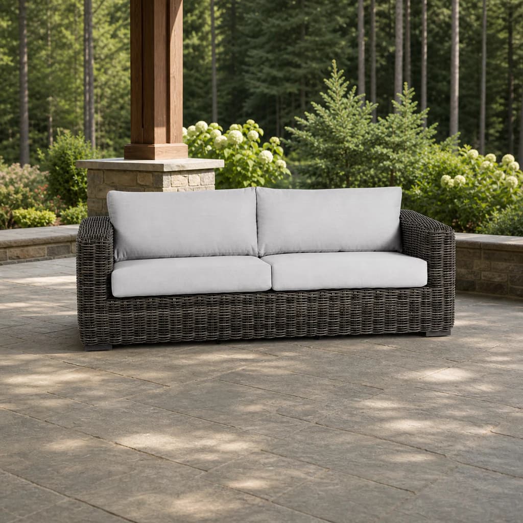 Ratana FN61203 Cubo 2.5-seater sofa on an evergreen stone patio.