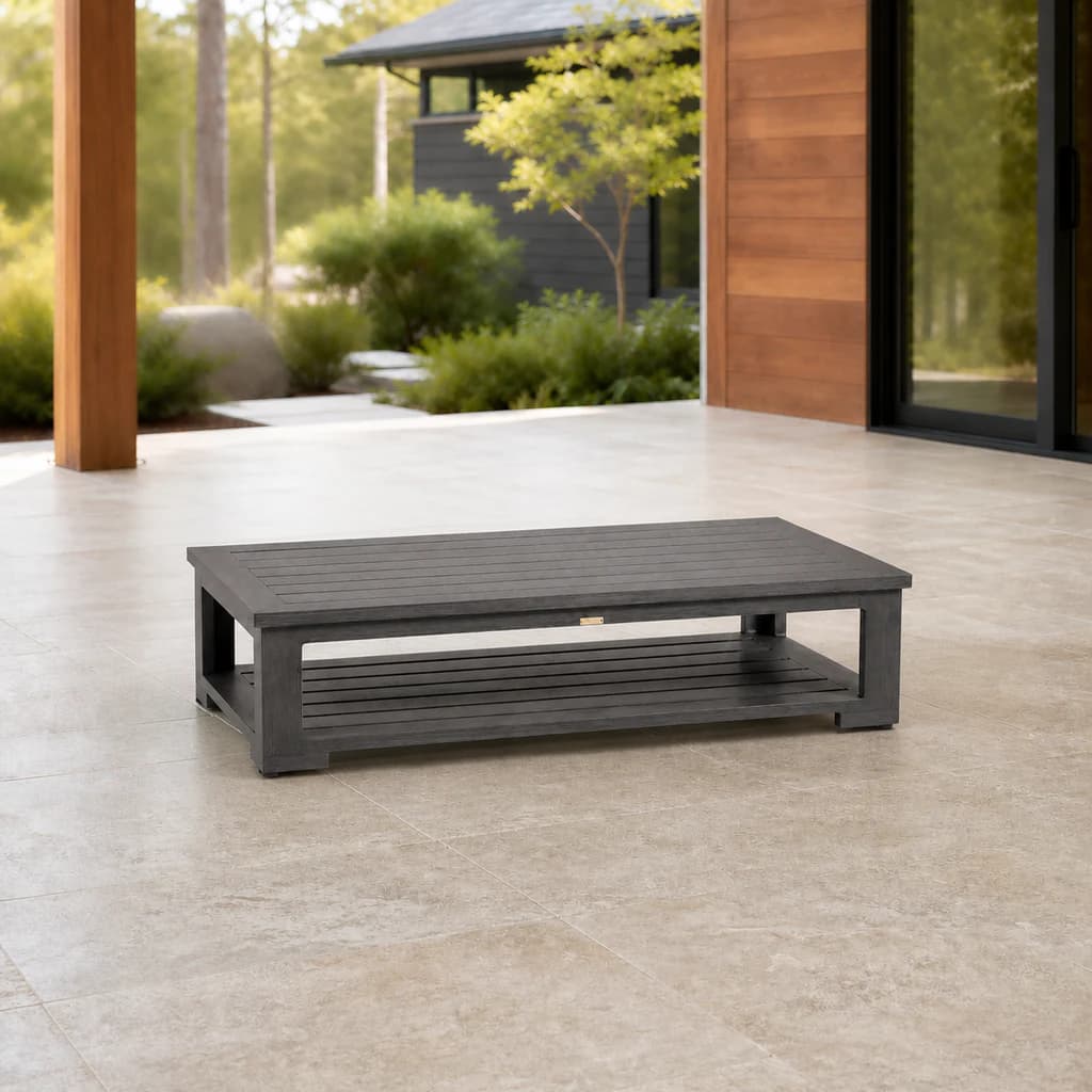 Ratana FN61204 Cubo rectangular coffee table with lower slatted shelf on a cedar patio.