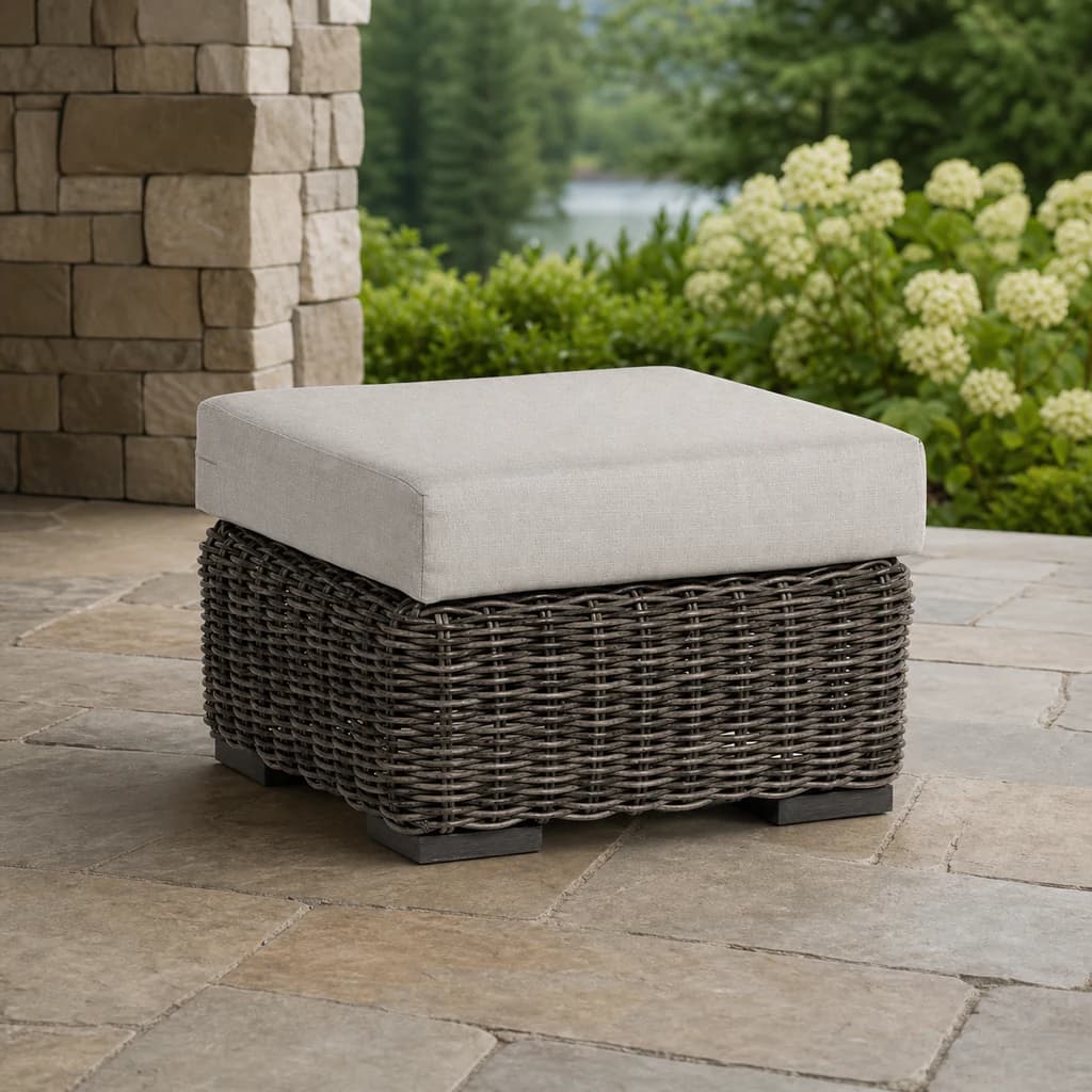 Ratana FN61216 Cubo ottoman with a pale cushion on a garden patio.