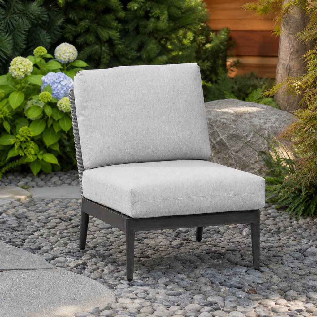 Ratana FN61353-C Poinciana armless sectional chair module in a Pacific Northwest garden.