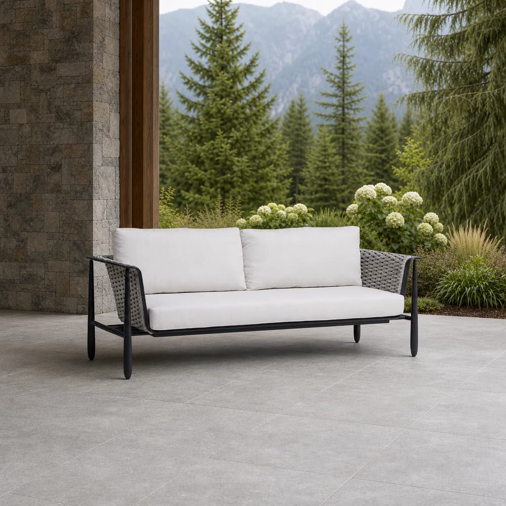 Ratana FN61603 Diva sofa on a covered evergreen stone patio.