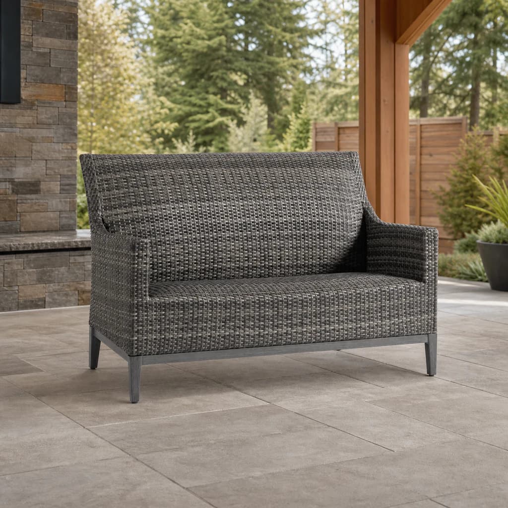 Ratana FN61702 Biltmore Love Seat in variegated charcoal weave on a cedar-and-stone patio.
