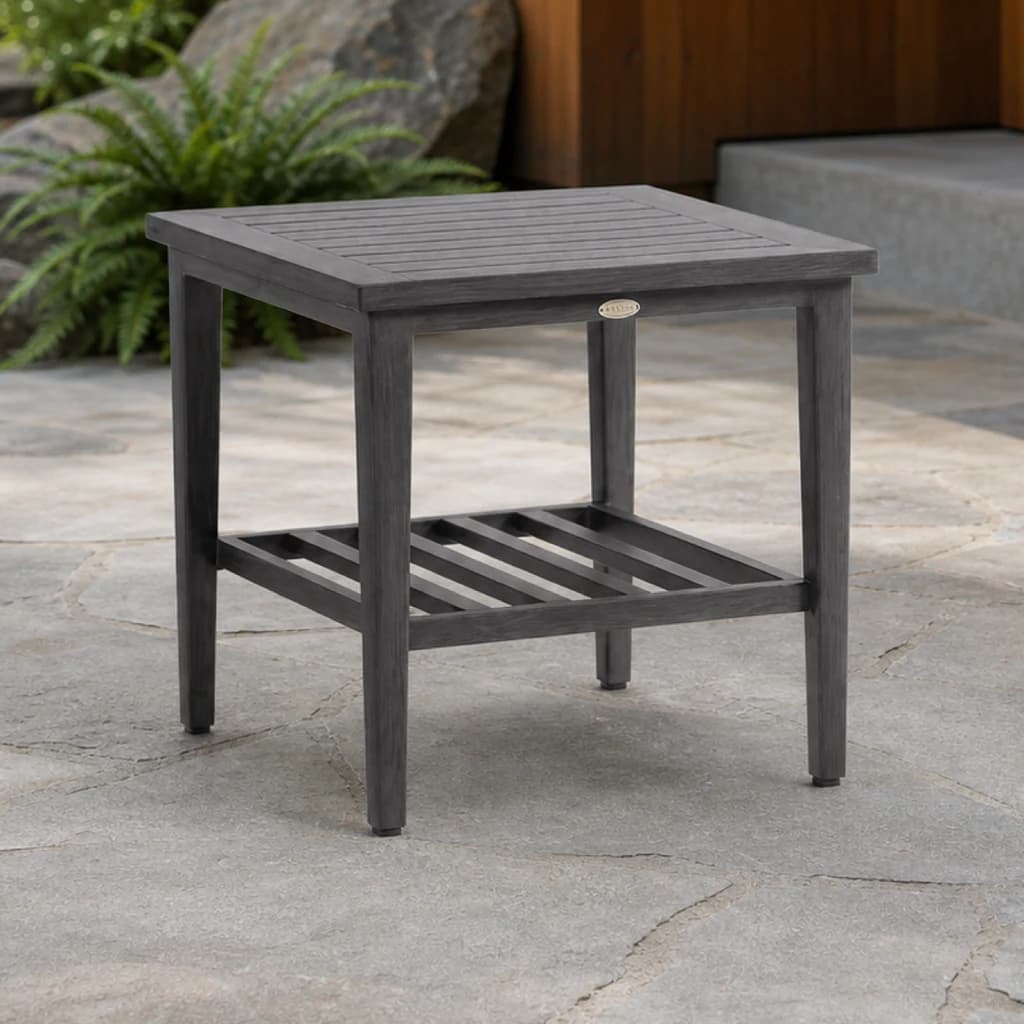 Ratana FN61705 Biltmore End Table with charcoal slatted top and lower shelf on a premium patio.