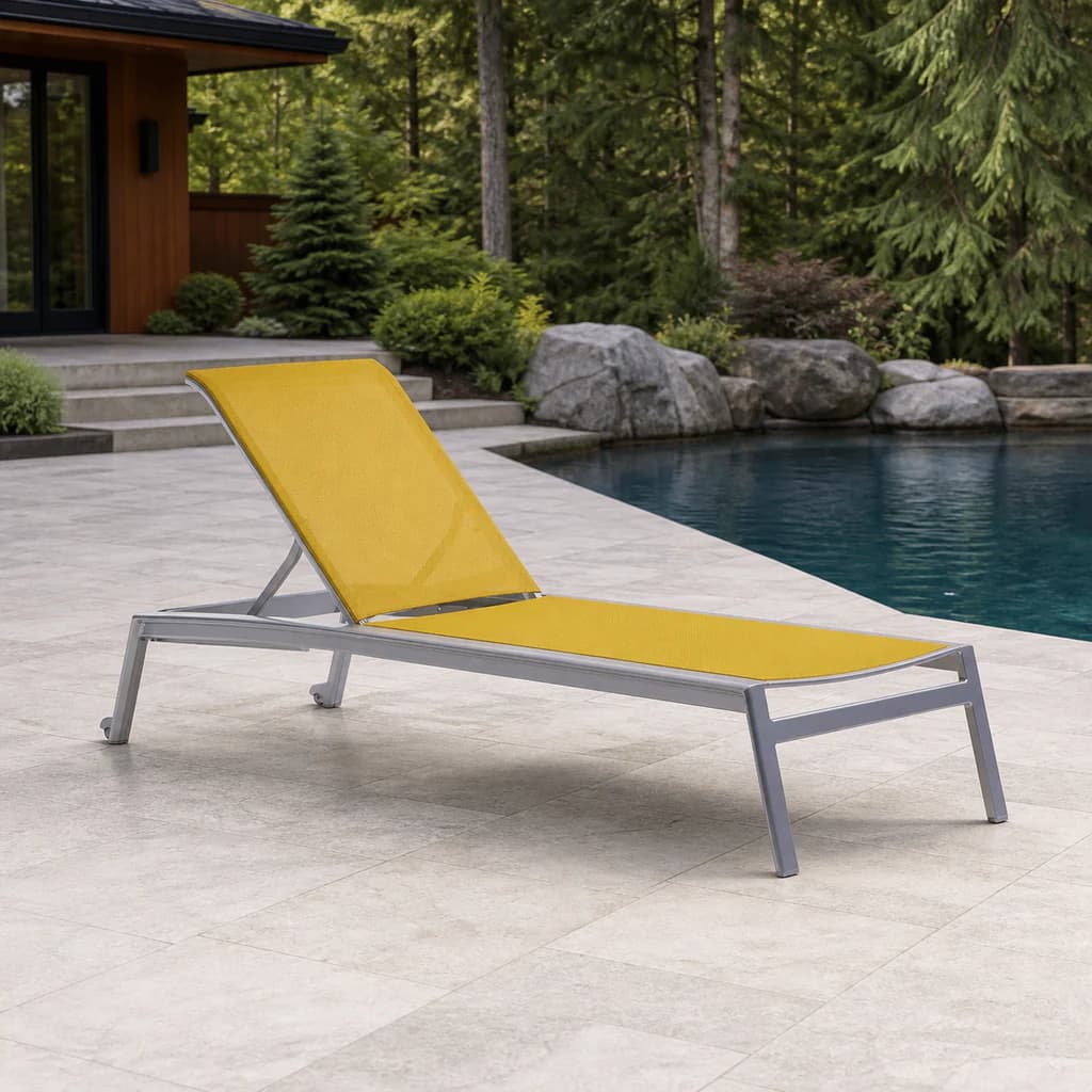Ratana FN61820 Lyon silver adjustable sling lounger with a plain yellow sling beside a Pacific Northwest pool.