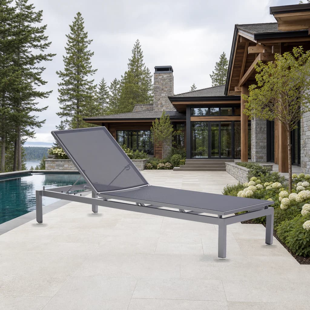 Ratana Toscana gray stackable adjustable lounger beside a premium Pacific Northwest pool.