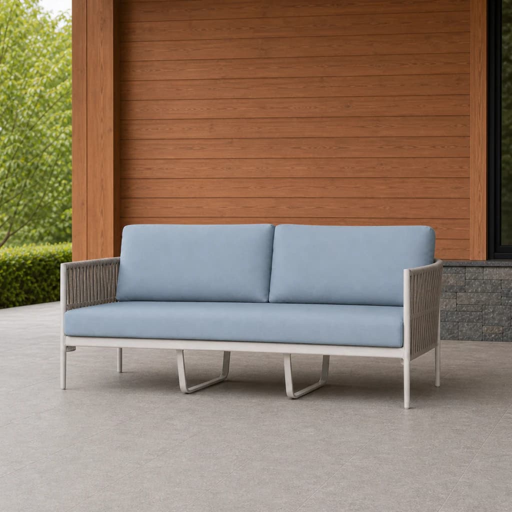 Ratana FN64703 Lineas sofa on a covered evergreen terrace.