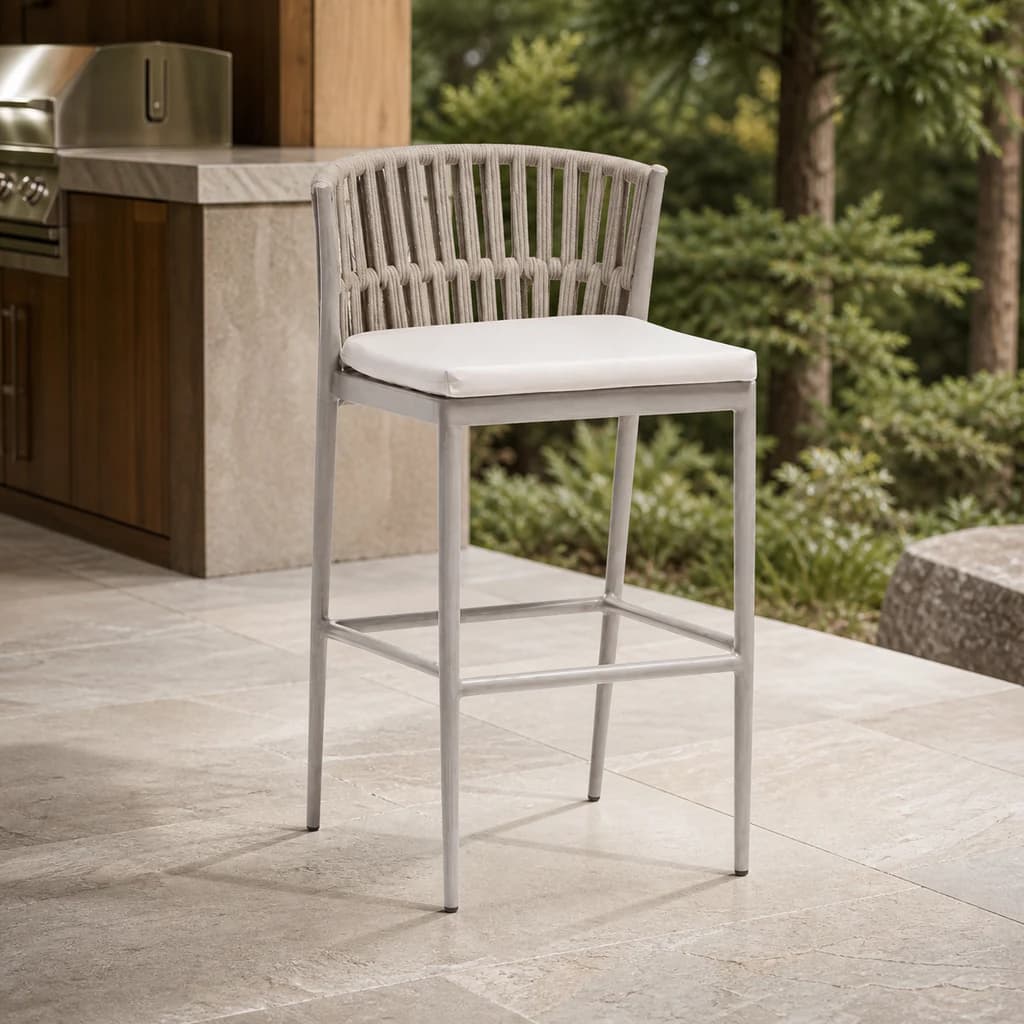 Ratana Lineas pale rope bar chair with a plain white cushion on a Pacific Northwest outdoor kitchen terrace.