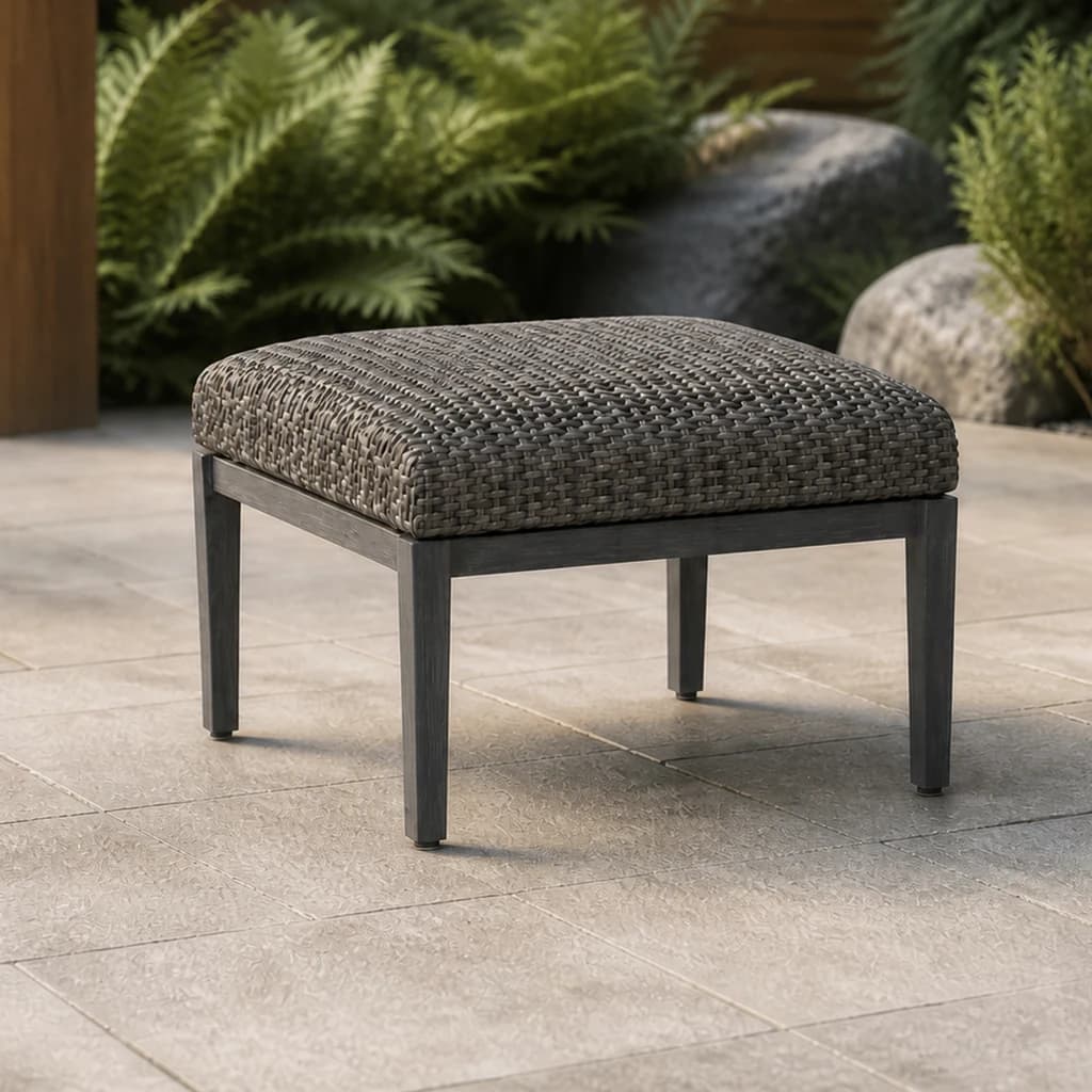 Ratana FN64916 Cabo San Lucas Ottoman in charcoal weave on a stone patio.