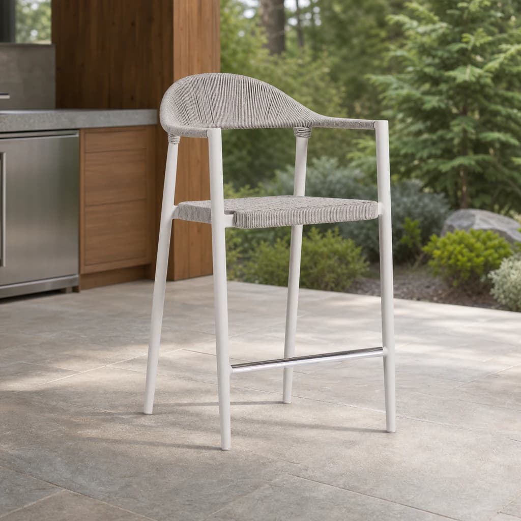 Ratana FN67446 Ballina pale woven counter chair with arms on a Pacific Northwest outdoor kitchen patio.