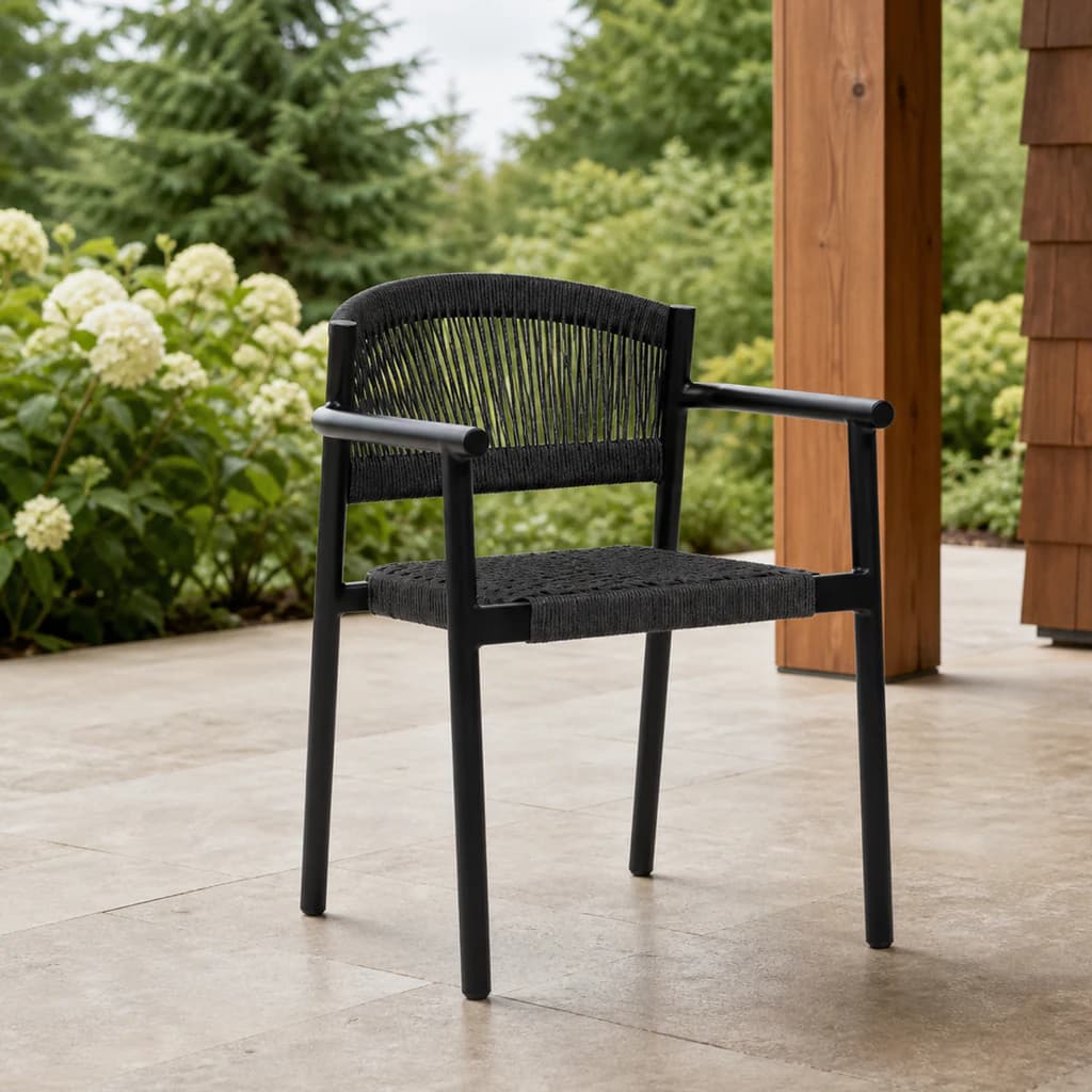 Ratana FN67512 Naples dining arm chair on a covered evergreen patio.