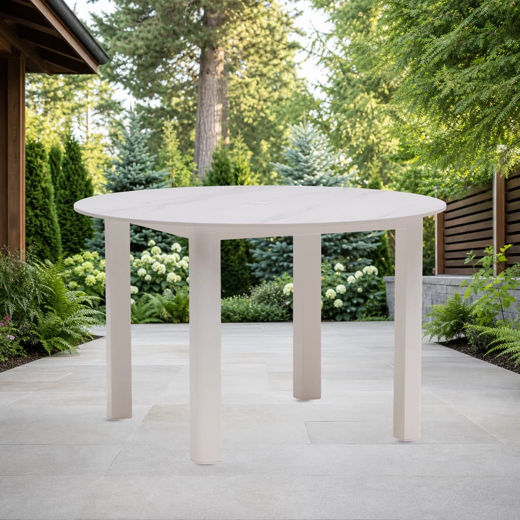 Ratana FN68310 Hampshire 48-inch round dining table with umbrella hole on a garden patio.