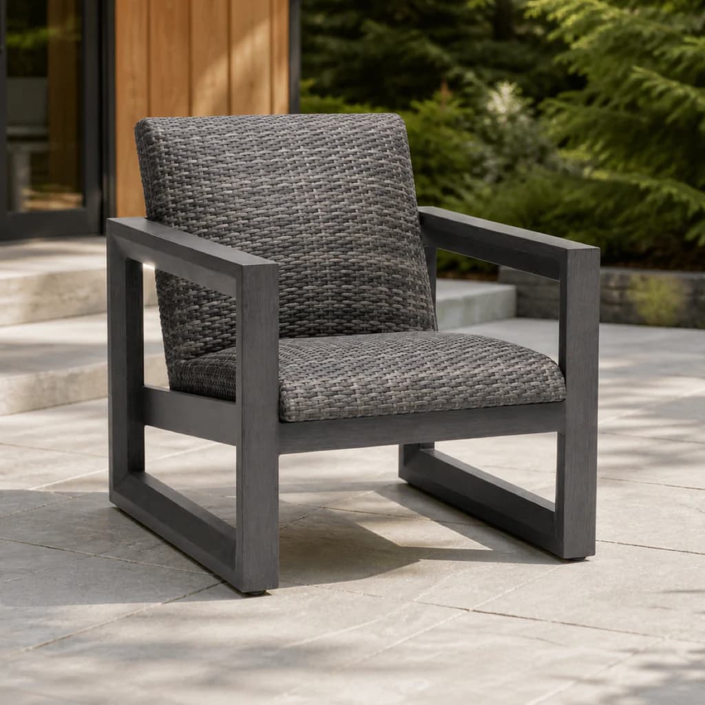 Ratana FN68401 Bergen Club Chair with charcoal aluminum frame and gray woven seat and back on a Pacific Northwest patio.